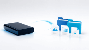 External hard drive beside digital files and folders representing accessible backup data